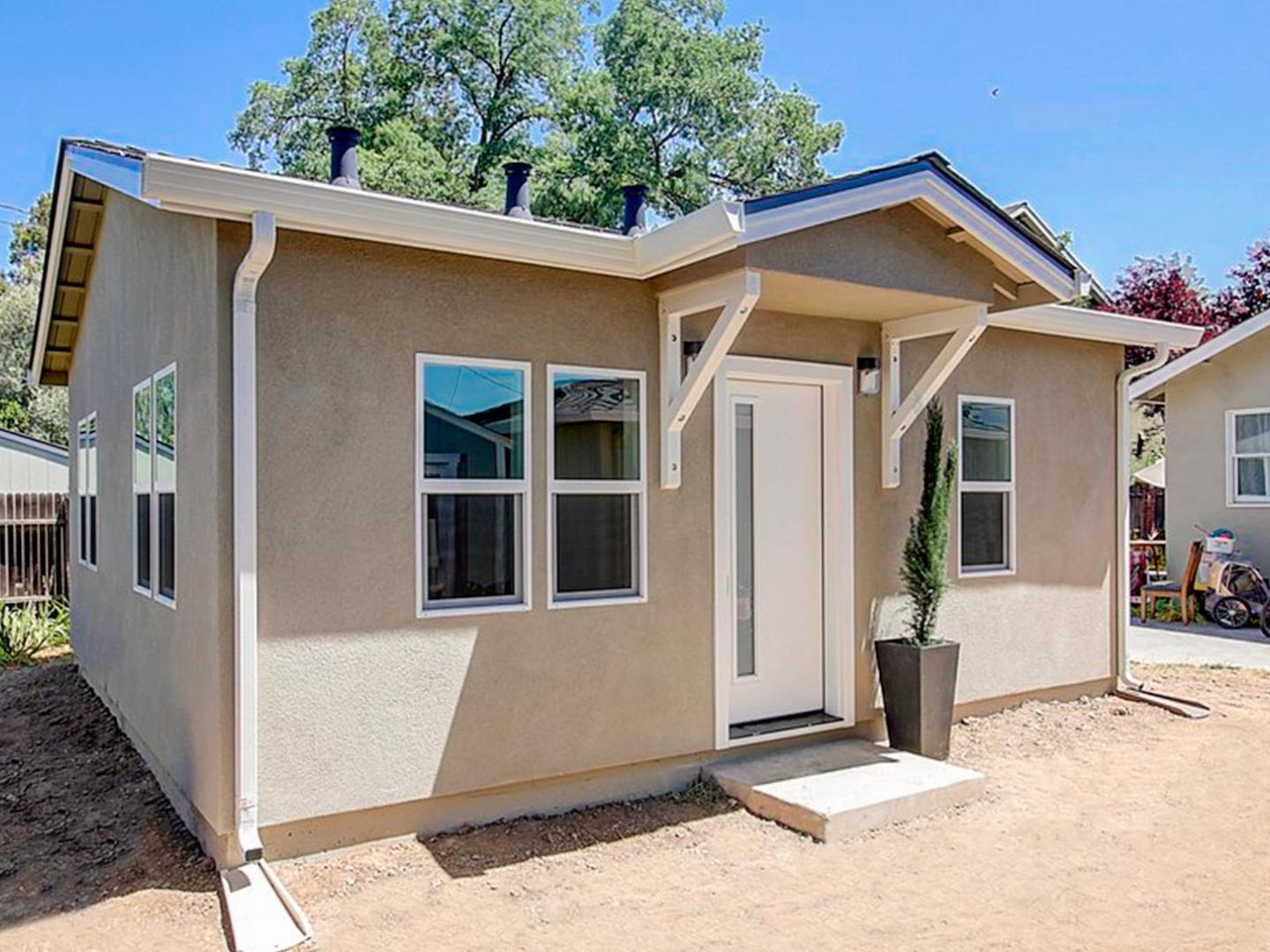 Completed detached stucco ADU exterior after legalization and permitting